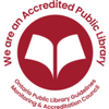 small logo of stylized white book on red background with red letter around it "We are an Accredited Library" 