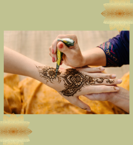 photograph of a hand having henna design applied to the back of it