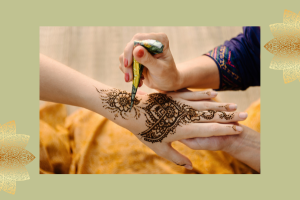 photo of henna being applied to the back of a hand