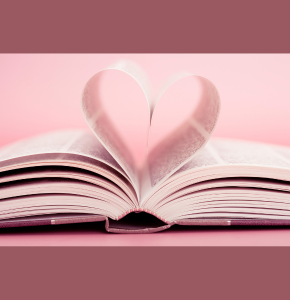 photo of an open book with two pages folded to form a heart