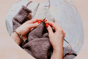 picture of a person's hands and a knitting project