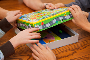 photo of hands opening a board game box