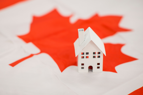 toy house on a Canadian flag