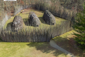 aerial view of are-creation of a longhouse village from 1,000 years ago