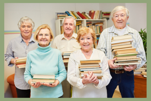 group of older adults holding books