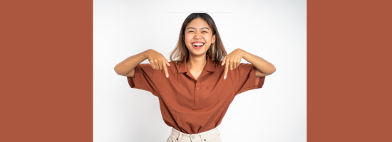 photograph of a woman pointing down