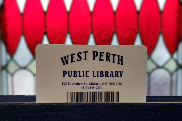 Library card in front of a stained glass window